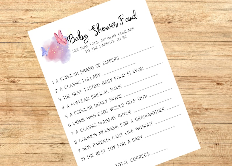 May include: A white Baby Shower Fend game sheet with fill-in-the-blank questions. The sheet features a watercolor design of pink and purple butterflies and text. Questions include a popular brand of diapers and a classic lullaby.