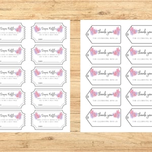 May include: Printed sheets of baby shower raffle tickets and thank you tags. The tickets read "Diaper Raffle" with space for a name and the tags say "thank you for celebrating with us." Both feature watercolor floral accents.