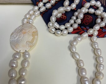 Sicilian necklace with two strands of baroque pearls and sardonic shell cameo.)