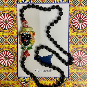 Lava necklace, long necklace, Caltagirone ceramic Moor&#39;s head, river pearls and coral chips.