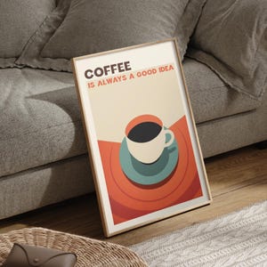 May include: A framed poster with a retro design featuring a cup of coffee on a saucer. The text on the poster reads "Coffee is always a good idea."