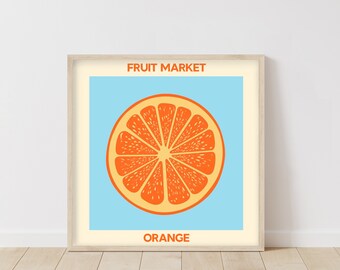 May include: A framed print with a blue background and a graphic of a sliced orange. The text "FRUIT MARKET" is at the top and "ORANGE" is at the bottom.