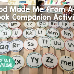 May include: Educational activity cards for children, featuring the alphabet from A to Z. Each card displays a letter, a positive affirmation, and the phrase "God Made Me." The cards are mounted on wooden sticks.