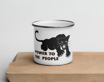 May include: White enamel mug with a black panther silhouette and the text "POWER TO THE PEOPLE" in orange.