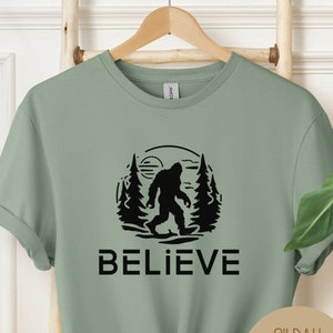 Believe Bigfoot Shirt, Weirdcore Cryptid Clothing, Cryptozoology Shirt, Retro Monster Tshirt Gift for Him or Her,Supernatural Christmas Gift