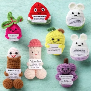 May include: A set of ten crocheted plushies, each shaped like a different fruit or vegetable, with a positive message on a tag attached to each. The plushies are in various colors, including red, green, yellow, purple, and brown.