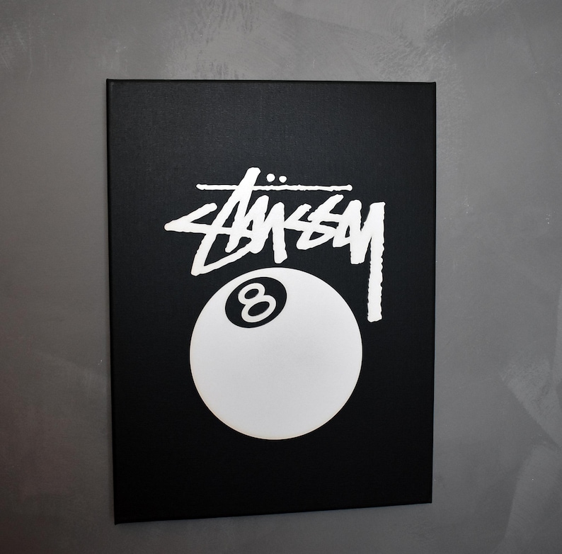 May include: Black and white canvas print featuring the Stussy logo and a white 8-ball.
