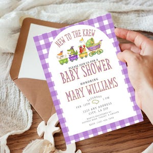 May include: A baby shower invitation with a purple gingham border. The invitation reads "New to the Krew" and "Baby Shower" honoring Mary Williams. The invitation includes the date, time, and location.