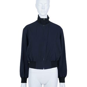 May include: A distressed wooden sign with the words "Welcome to our home" in white lettering. The sign has a rustic finish and a simple design, ideal for a front door.