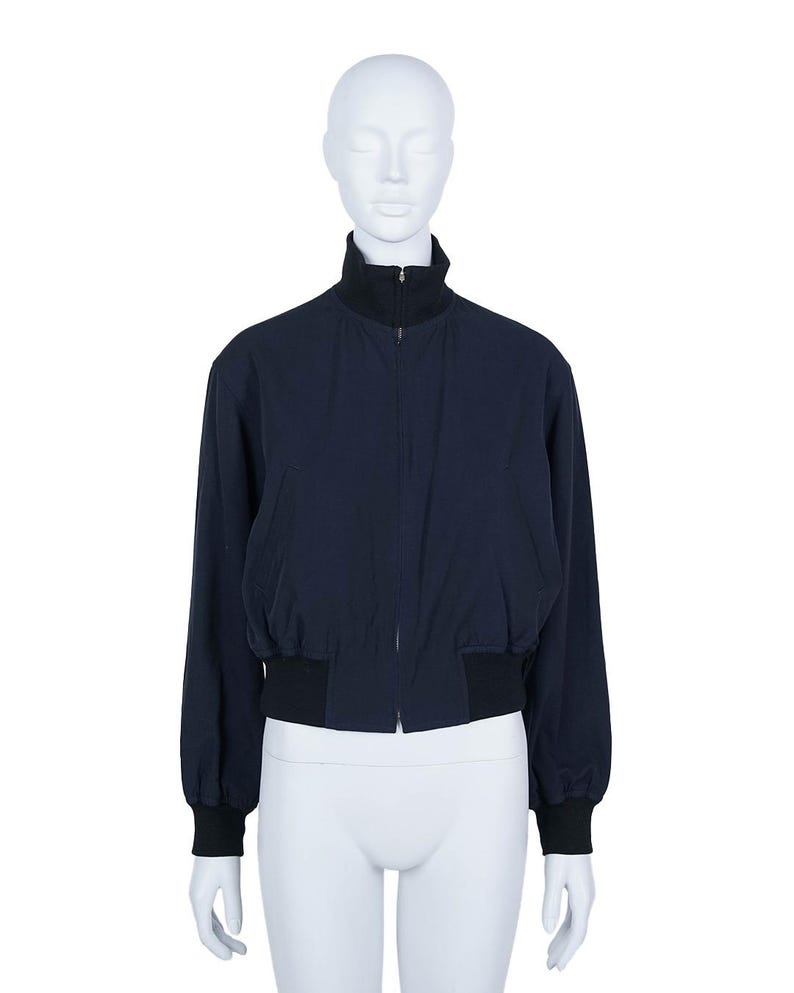 May include: A distressed wooden sign with the words "Welcome to our home" in white lettering. The sign has a rustic finish and a simple design, ideal for a front door.