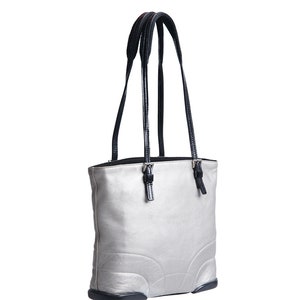 May include: A silver leather tote bag with black straps and buckles. The bag has a quilted design and a structured shape.