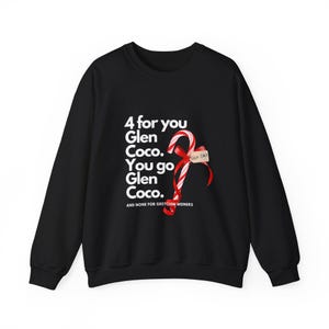 May include: Black crewneck sweatshirt with white text: "4 for you Glen Coco. You go Glen Coco." A candy cane with a red ribbon and a small tag is on the right side. The text "AND NONE FOR GRETCHEN WEINERS" is at the bottom.