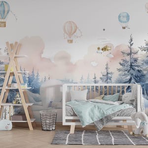 May include: A nursery scene with a white crib, a wooden bookshelf, and a whimsical mural featuring hot air balloons and a forest scene in soft pastel colors. A rocking elephant and whale plush add to the decor.