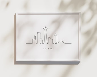 May include: A black and white line drawing of the Seattle skyline, including the Space Needle. The text "SEATTLE" is below the skyline.