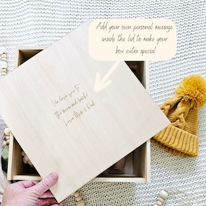 May include: A wooden box with a lid that can be personalized with a message. The lid is open and the inside of the box is empty. The lid has the text "We love you to the moon and back! Love Mum & Dad" engraved on it.