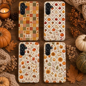 May include: Four rectangular phone cases featuring autumn-themed designs. The top left case has a checkered pattern with pumpkins and leaves. The other three cases display patterns of pumpkins, mushrooms, sunflowers, and leaves. Each case includes the text A.R.