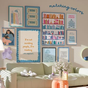 May include: A collection of framed art prints with a reading theme, including illustrations of bookshelves, quotes, and a person reading. The color palette features blues, pinks, and neutral tones, creating a cozy and inviting atmosphere. The text "matching colors" is visible.