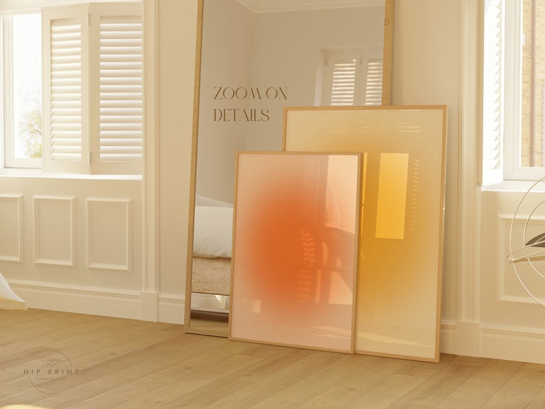May include: Two framed abstract art prints with a gradient colour scheme. The larger print is a yellow to orange gradient, and the smaller print is a red to orange gradient. The text "ZOOM ON DETAILS" is visible in the background.