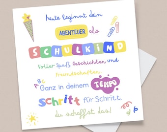 May include: A white card with German text and illustrations. The text includes phrases like "heute beginnt dein ABENTEUER als SCHULKIND". Features a school cone, paper clips, and a star. The card is on a light beige surface.