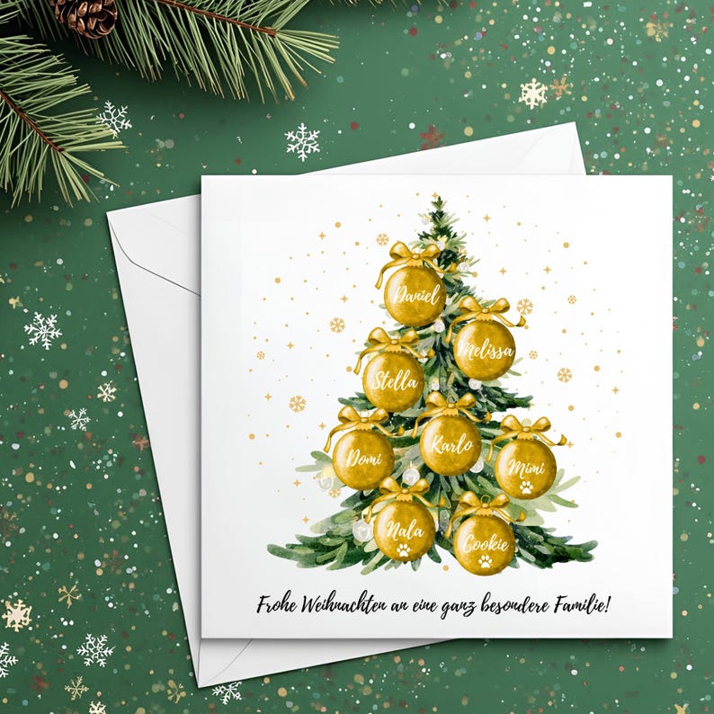 May include: A white Christmas card with a watercolor Christmas tree decorated with gold ornaments, each bearing a name. The card includes the text "Frohe Weihnachten an eine ganz besondere Familie!" on a green background with snowflakes.