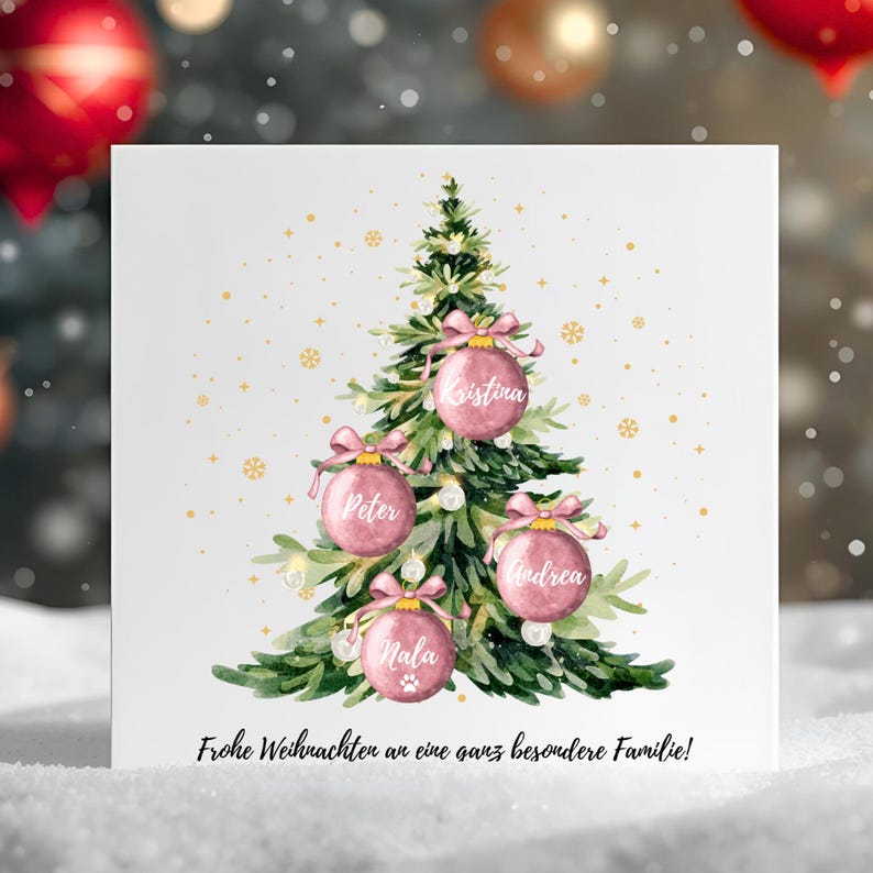 May include: A Christmas card featuring a watercolor illustration of a decorated Christmas tree with pink ornaments. Each ornament has a name on it. The card has the text "Frohe Weihnachten an eine ganz besondere Familie!" at the bottom.