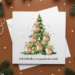 May include: A white Christmas card featuring a watercolor illustration of a Christmas tree adorned with personalized ornaments. Each ornament displays a name. The card includes the text "Frohe Weihnachten an eine ganz besondere Familie!"