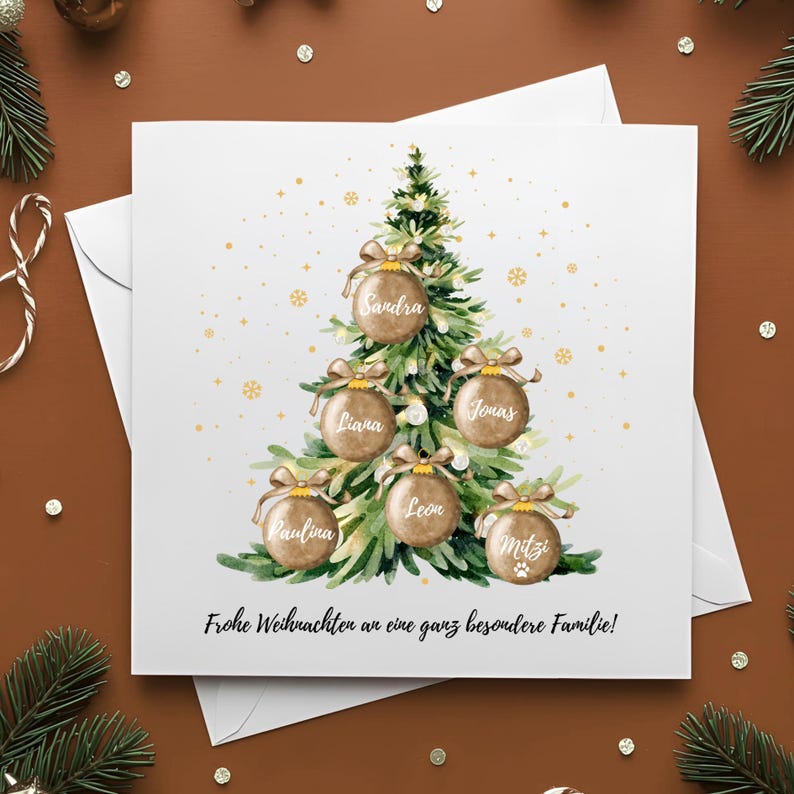 May include: A white Christmas card featuring a watercolor illustration of a Christmas tree adorned with personalized ornaments. Each ornament displays a name. The card includes the text "Frohe Weihnachten an eine ganz besondere Familie!"