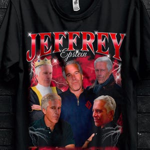 May include: Black t-shirt featuring a graphic of several men with the name "JEFFREY Epstein" in red and white. The shirt includes promotional text for bulk purchases and a "Buy 3 Get 1 Free" offer.