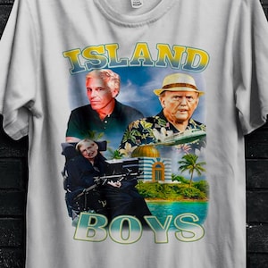 May include: White t-shirt featuring the text "ISLAND BOYS" with images of three men. The shirt has a tropical theme with palm trees and a building. A gold circle reads "50% OFF" and "BULK50".
