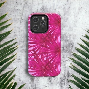 May include: A pink phone case with a tropical leaf design. The leaves are a vibrant pink color and are arranged in a repeating pattern.