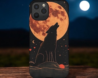 May include: Black phone case featuring a howling wolf silhouette against a large orange moon. The design includes stars, hearts, and a smaller moon in a night sky setting. The case is on a wooden surface.