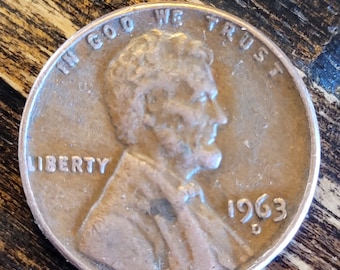 1963 penny from the Denver mint.  Mistake is the L on the ridge. Has been circulated.