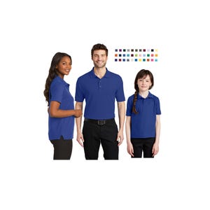 May include: Three people wearing short-sleeved, royal blue polo shirts. The shirts have a collared neckline and button closure. The person in the center is wearing a black belt and black pants. A color chart with various colors is in the background.