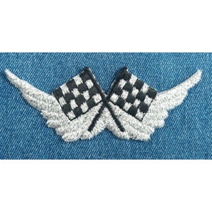 May include: A silver embroidered patch with two checkered flags crossed over each other. The flags are black and white and the wings are silver.