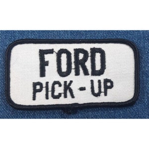 May include: White rectangular patch with black embroidered text that reads "FORD PICK-UP".