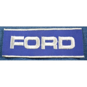 May include: White embroidered "FORD" lettering on a blue rectangular patch.