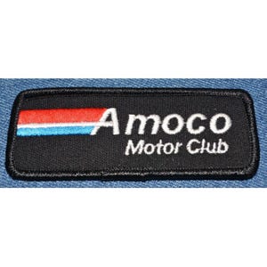 May include: Black and white embroidered patch with the text "Amoco Motor Club" and a red, white, and blue stripe.