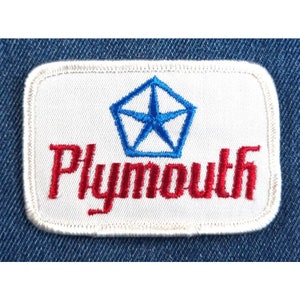 May include: White embroidered patch with a blue five-pointed star in a pentagon shape and the word "Plymouth" in red lettering.