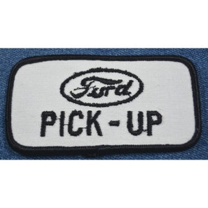 May include: White embroidered patch with black stitching. The patch features the Ford logo and the words "PICK-UP".