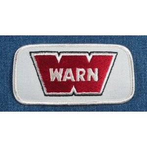 May include: White embroidered patch with a red "W" logo and the word "WARN" in white lettering.