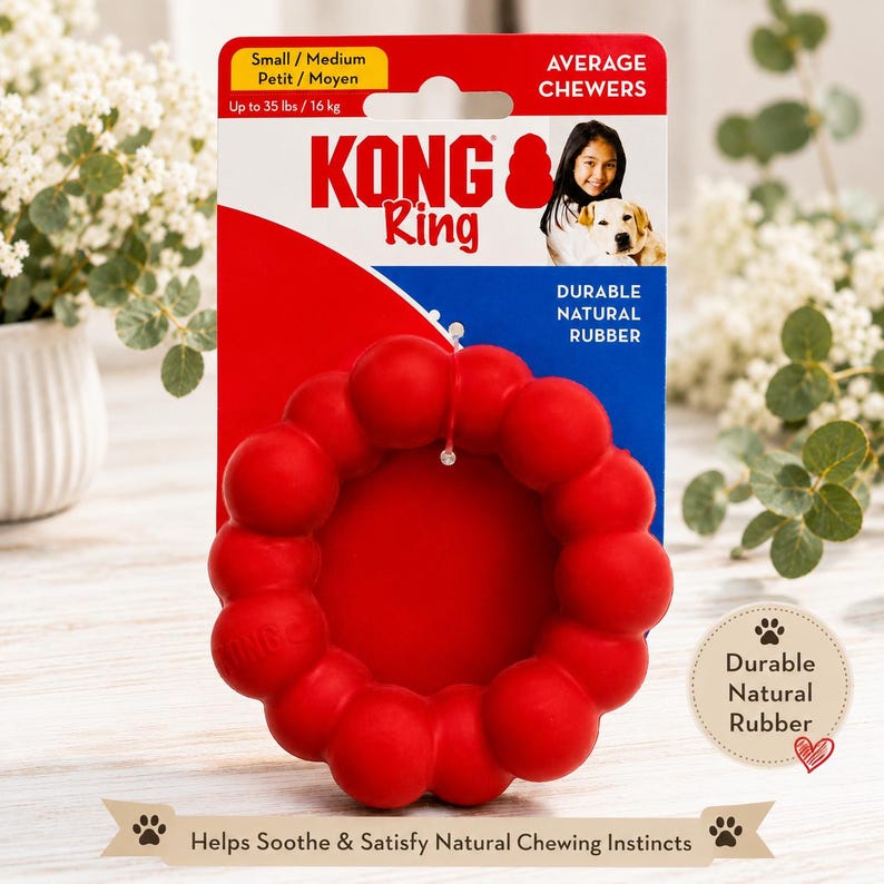 May include: A red KONG Ring dog toy made of durable natural rubber, designed for small to medium dogs up to 35 lbs. The packaging features the KONG logo, text stating Average Chewers, and an image of a person with a dog. The toy is circular.