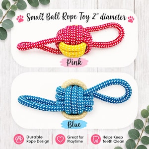 May include: Two small ball rope toys with a 2-inch diameter. The top toy is pink with white flecks and a yellow center. The bottom toy is blue with white flecks and a beige center. Both feature a knotted ball design with looped ends for pulling.