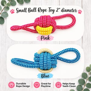May include: Two small ball rope toys with a 2-inch diameter. The top toy is pink with white flecks and a yellow center. The bottom toy is blue with white flecks and a beige center. Both feature a knotted ball design with looped ends for pulling.