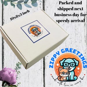 May include: A white cardboard shipping box measuring 10x8x3 inches with a square sticker featuring a blue dog and orange cat wearing glasses. The text reads Zippy Greetings, made with love in every box, and packed and shipped next business day.