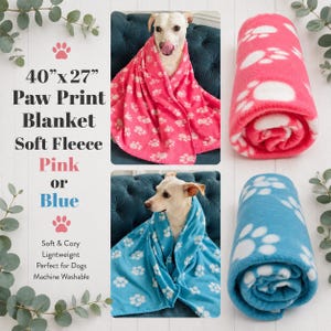 May include: A 40-inch by 27-inch soft fleece blanket featuring a white paw print pattern, available in pink or blue. The blanket is shown draped over a dog and also rolled up. Text on the image reads 40 inch by 27 inch Paw Print Blanket.