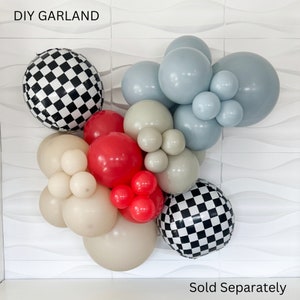 May include: DIY garland with black and white checkered balloons, red balloons, beige balloons, and light blue balloons.  The text "DIY GARLAND" is at the top of the image. The text "Sold Separately" is at the bottom of the image.
