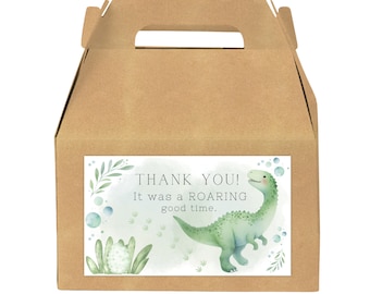 May include: A brown cardboard gift box with a handle. A white label features a green dinosaur illustration and the text "THANK YOU! It was a ROARING good time."