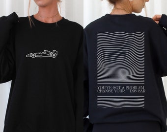 May include: Black sweatshirt with a white outline of a racing car on the front and the text "YOU'VE GOT A PROBLEM CHANGE YOUR THINKING" on the back.