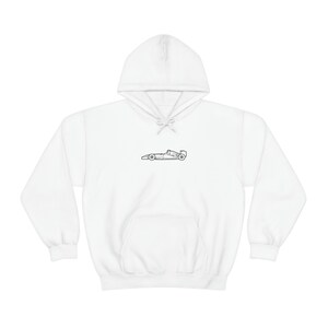 May include: White hooded sweatshirt with a black outline of a racing car on the front.