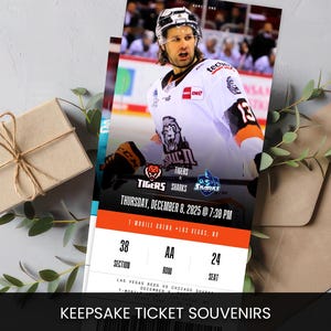 May include: A keepsake ticket souvenir featuring a hockey player in a white and orange jersey. The ticket is for a Tigers vs Sharks game at T-Mobile Arena, Las Vegas, on December 8, 2025. The text "KEEPSAKE TICKET SOUVENIRS" is at the bottom.